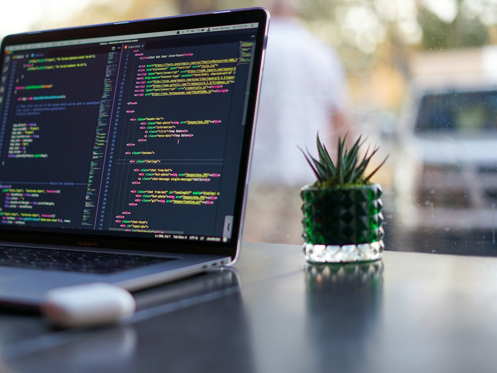 Custom course platform code running on a laptop screen
