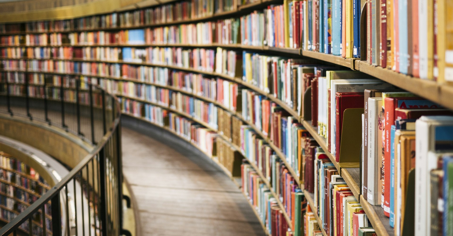 Rows of bookshelves in a library, representing depth of learning content