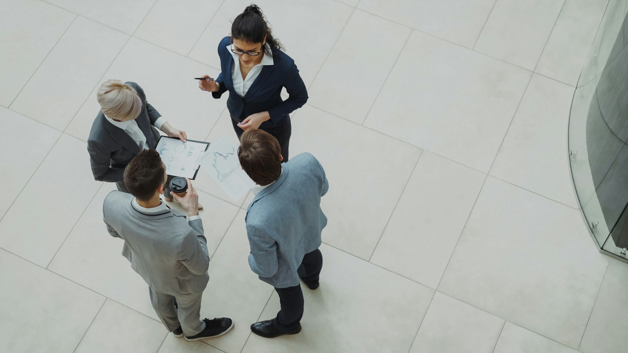 Team reviewing performance reports together in a modern office
